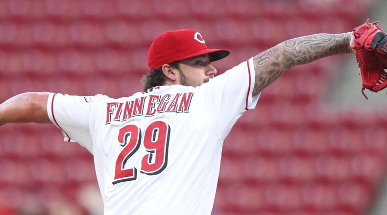 Reds starter Brandon Finnegan pitches against the Brewers on Monday, April 30, 2018, at Great American Ball Park in Cincinnati. David Jablonski/Staff