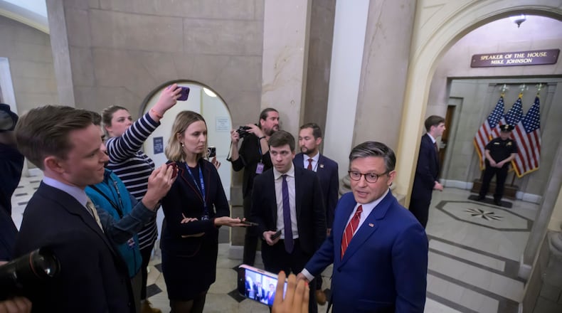 Speaker of the House Mike Johnson, R-La., talks with reporters outside his office at the U.S. Capitol, Wednesday, Nov. 12, 2025, in Washington. (AP Photo/Rod Lamkey, Jr.)