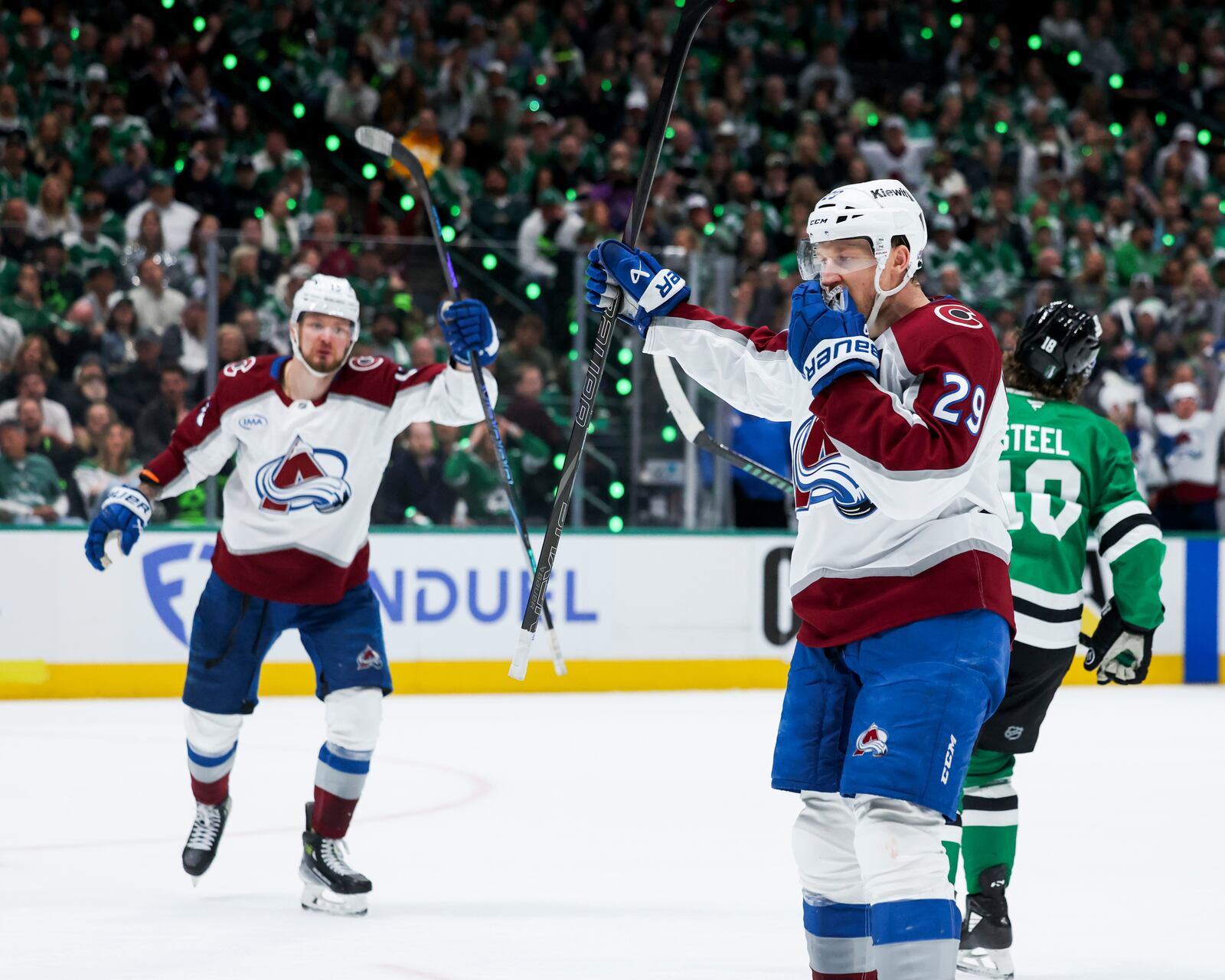 Colorado Avalanche center Nathan MacKinnon (29) celebrates after scoring a power-play goal during a first-round NHL hockey playoff game against the Dallas Stars in Dallas, Saturday, April 19, 2025. (AP Photo/Gareth Patterson)