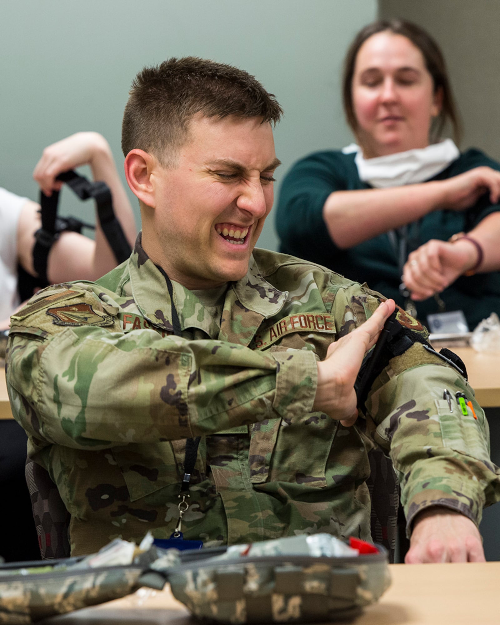 Maj. Christopher Fassio, a LEADership Wright-Patt student, applies a tourniquet to his arm during an 88th Medical Group demonstration on May 3 at Wright-Patterson Air Force Base. U.S. AIR FORCE PHOTO/JAIMA FOGG