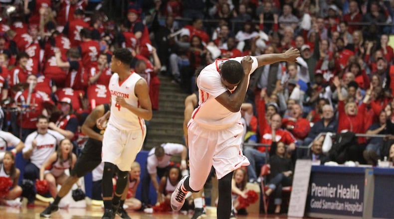 Dayton’s Scoochie Smith celebrates after a 3-pointer in the first half against Virginia Commonwealth on Saturday, March 5, 2016, at UD Arena in Dayton. David Jablonski/Staff