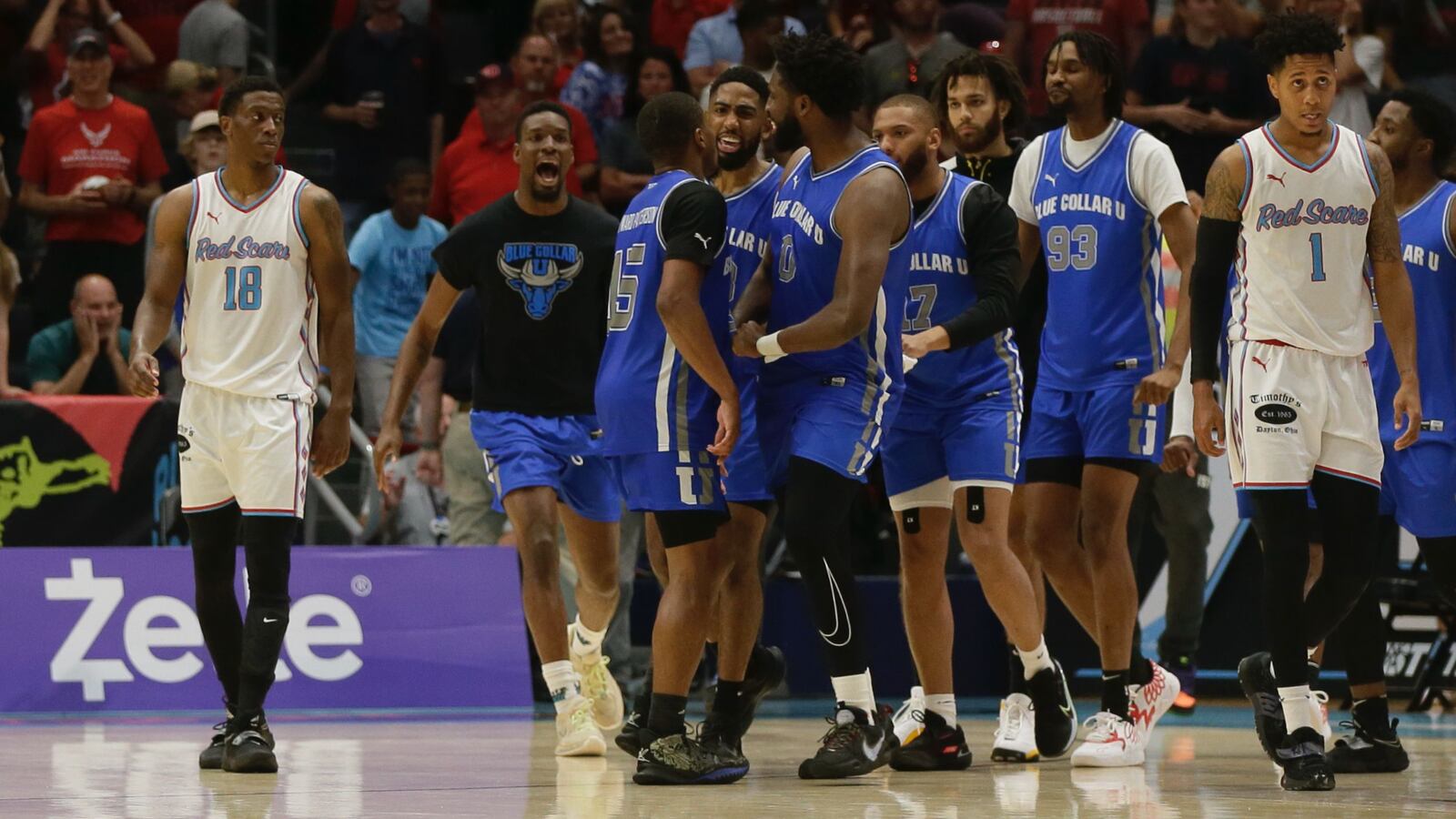 Blue Collar U celebrates a victory against Red Scare in the semifinals of The Basketball Tournament on Saturday, July 30, 2022, at UD Arena. David Jablonski/Staff