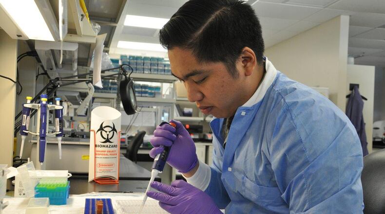 Staff Sgt. John Patrick Uy, medical laboratory technician, conducts a manual Q fever test screening for patients at the 711th Human Performance Wing’s United States Air Force School of Aerospace Medicine Public Health and Epidemiology Laboratory Aug. 16. (U.S. Air Force photo/Bryan Ripple)