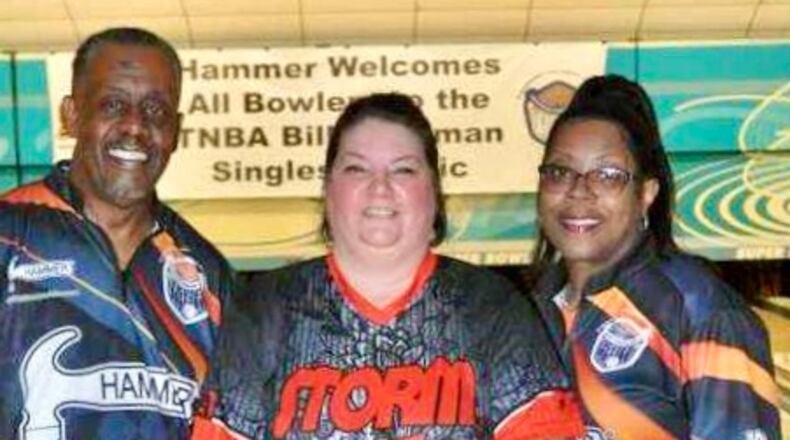 Ann Coleman (center) celebrates her win with interim tournament director Jerome Lewis and assistant tournament director Amy Daniels - Contributed