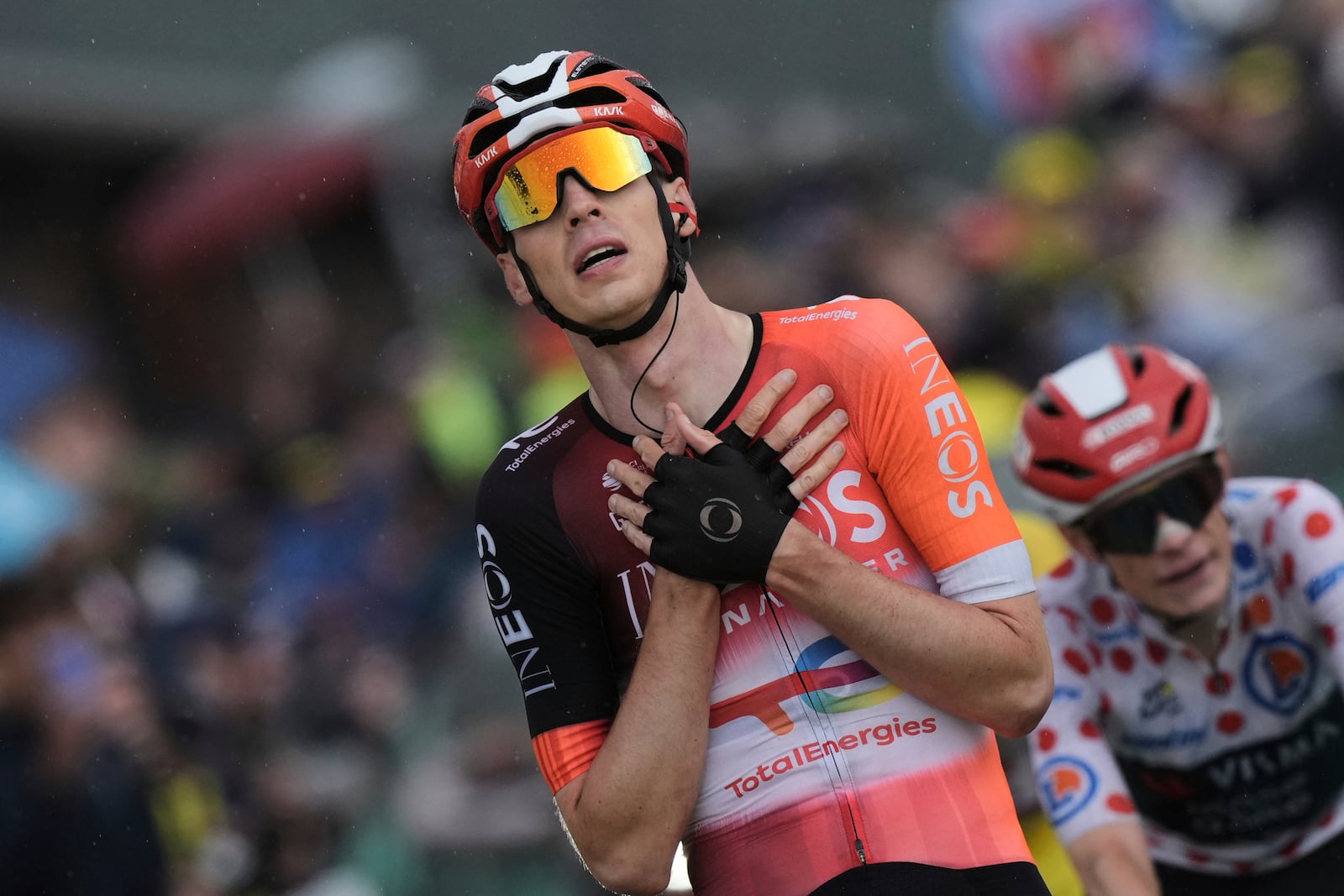 Netherlands' Thymen Arensman crosses the finish line ahead of Denmark's Jonas Vingegaard, wearing the best climber's dotted jersey, to win the nineteenth stage of the Tour de France cycling race over 93.1 kilometers (57.85 miles) with start in Albertville and finish in La Plagne, France, Friday, July 25, 2025. (AP Photo/Thibault Camus)