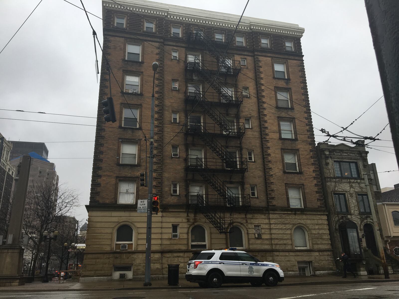 Dayton police earlier this month stopped by the Newcom apartments on North Main Street downtown. CORNELIUS FROLIK / STAFF