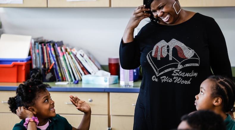 Angela Worley talks with students during the after school program at Westwood Elementary School on Oakridge Dr. JIM NOELKER/STAFF