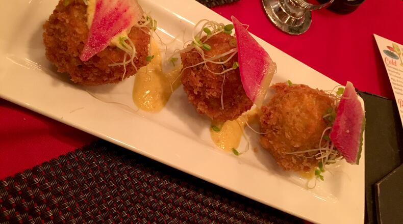 This arroz con pollo arancini  dish was among those served at Barcelona Tapas at El Meson in West Carrollton.   Photo: Amelia Robinson