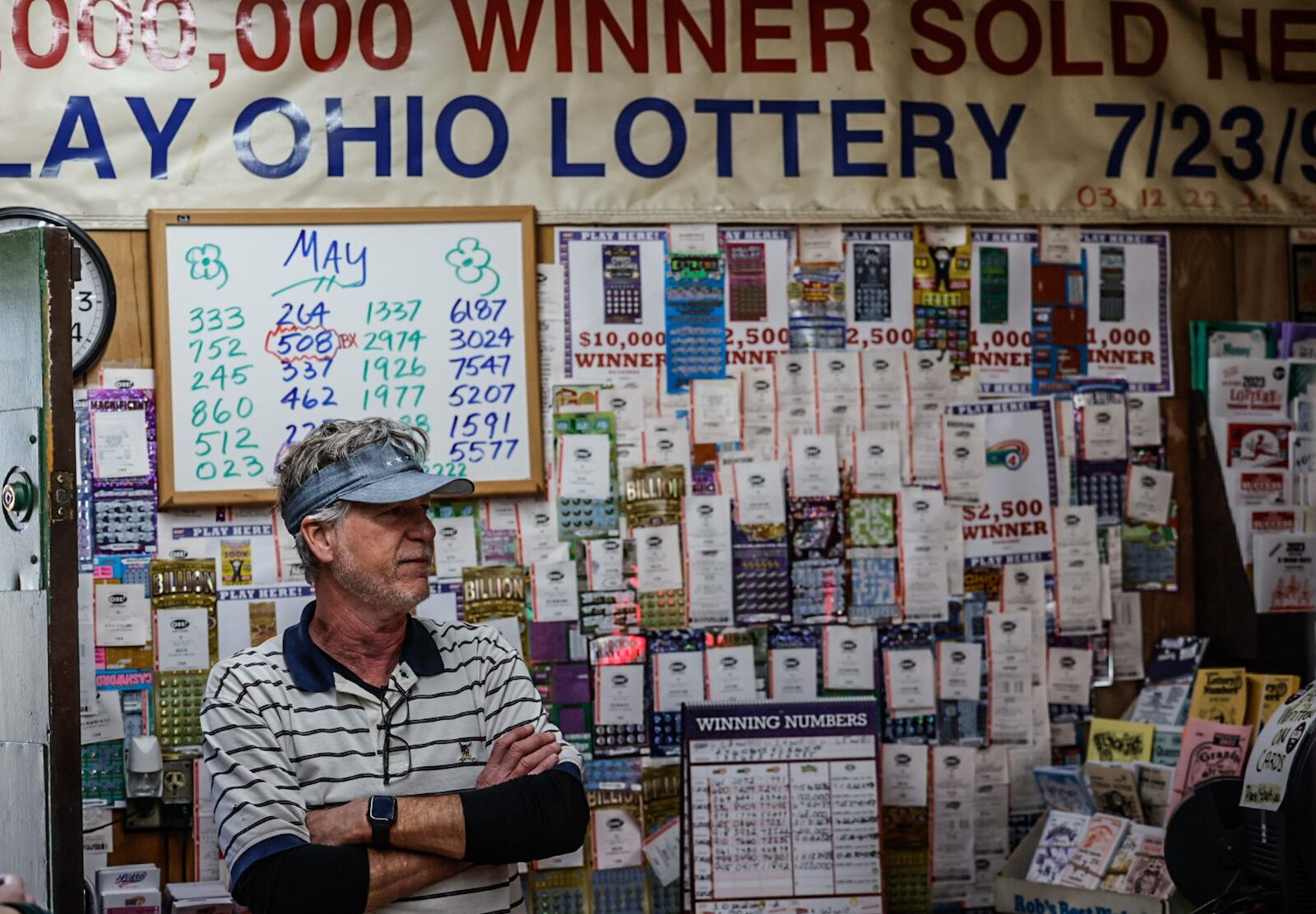 Vinny Nyhan, owner of Vinny's Bar & Grill, Carry-out, Lottery in Moraine, has seen an increase in lottery sales this year, and described his business as one of the top 10 lottery sellers in the Dayton area. JIM NOELKER/STAFF