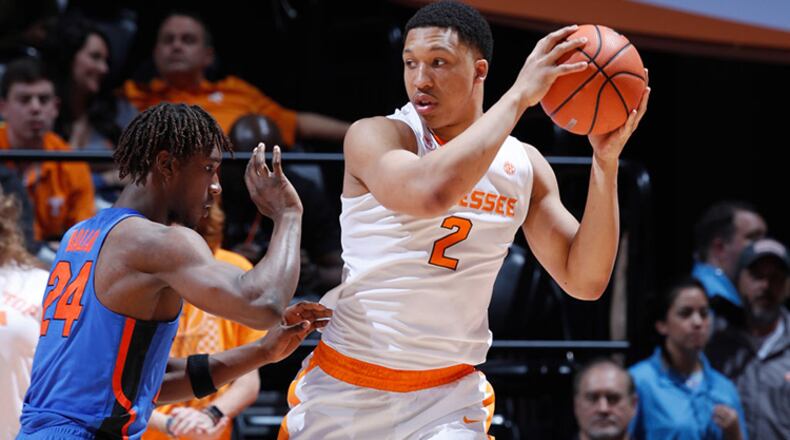 KNOXVILLE, TN - FEBRUARY 21: Grant Williams #2 of the Tennessee Volunteers looks to the basket against Deaundrae Ballard #24 of the Florida Gators in the second half of a game at Thompson-Boling Arena on February 21, 2018 in Knoxville, Tennessee. Tennessee won 62-57. (Photo by Joe Robbins/Getty Images)