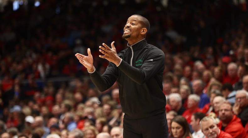 George Mason's Kim English coaches during a game against Dayton on Saturday, Feb. 25, 2023, at UD Arena. David Jablonski/Staff