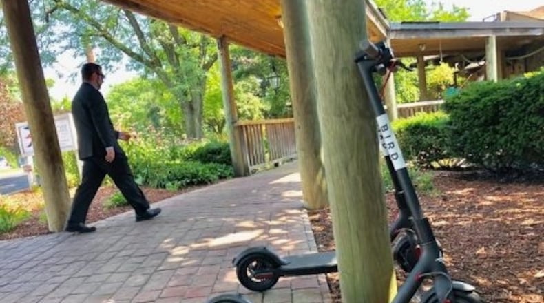A Bird electric scooter is seen near the Boat House in Columbus. Dayton leaders established rules this week in anticpation of FRED SQUILLANTE/DISPATCH