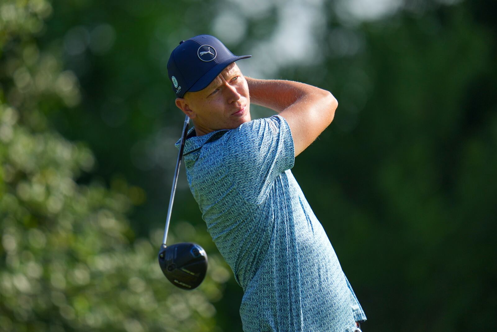 Matti Schmid wathches his tee shot on the 9th hole during the first round of the Charles Schwab Challenge golf tournament at Colonial Country Club in Fort Worth, Texas, Thursday, May 22, 2025. (AP Photo/Julio Cortez)