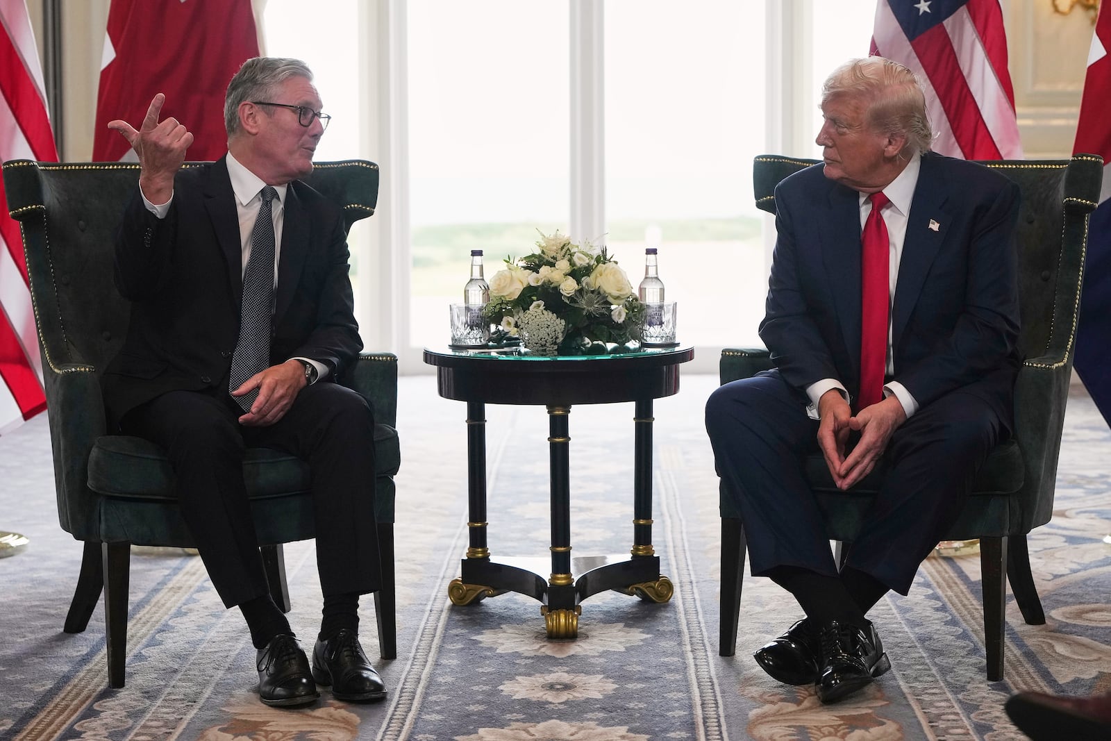 President Donald Trump meets with Britain's Prime Minister Keir Starmer, left, at Trump Turnberry golf club on Monday, July 28, 2025 in Turnberry, Scotland. (Christopher Furlong/Pool Photo via AP)
