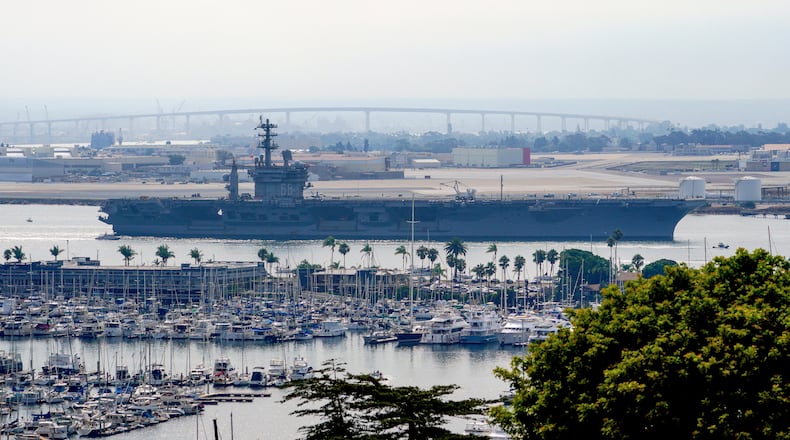 FILE - The USS Nimitz (CVN 68) departs San Diego Bay, Aug. 19, 2023, at Mission Beach, in San Diego. (Nelvin C. Cepeda/The San Diego Union-Tribune via AP, File)