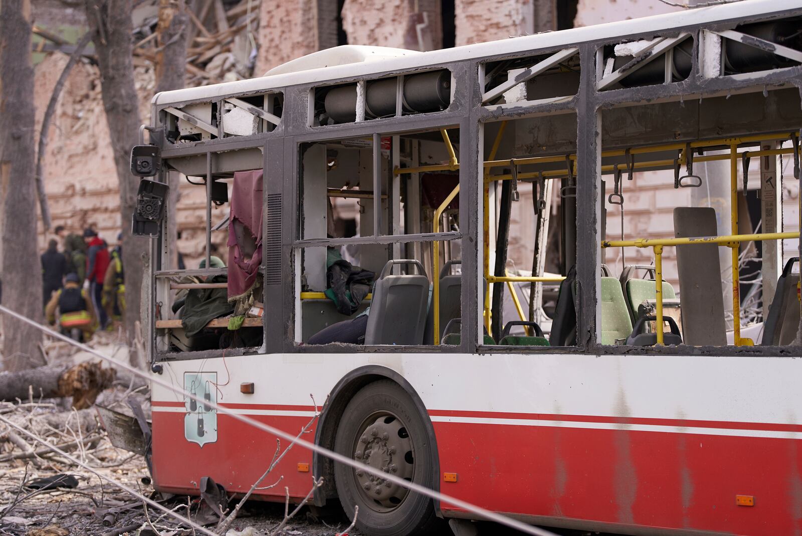 A damaged public bus is seen in the city center after Russia's missile attack that killed at least 21 civilians in Sumy, Ukraine, Sunday, April 13, 2025. (AP Photo/str)