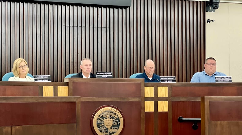 Members of Vandalia City Council listen as residents address the dais during Wednesday's special meeting. AIMEE HANCOCK/STAFF