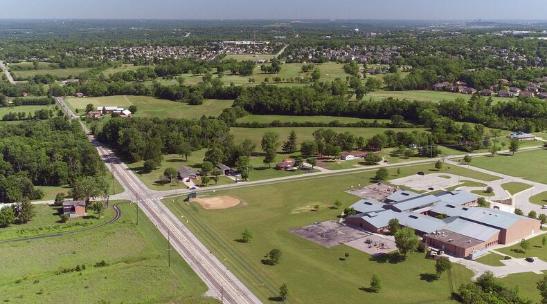 An annexation deal for 41 acres about a mile from a growing I-75 interchange may bring more than 100 new homes to Miamisburg and additional tax revenue for Miami Twp. The land is on Miamisburg Springboro and Medlar roads, north of Medlar View Elementary School. TY GREENLEES / STAFF