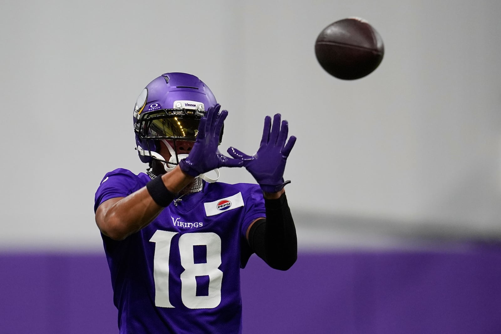 Minnesota Vikings wide receiver Justin Jefferson (18) takes part in drills during the team's NFL football training camp Wednesday, July 23, 2025, in Eagan, Minn. (AP Photo/Abbie Parr)