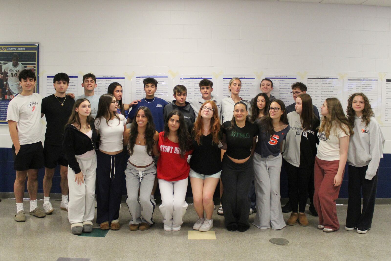 Twin students pose for a group photo during rehearsal for Plainview-Old Bethpage John F. Kennedy High School's graduation ceremony at Hofstra University in Hempstead, N.Y., on Tuesday, June 17, 2025. (AP Photo/Philip Marcelo)