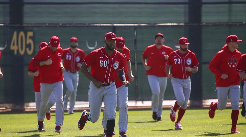 Cincinnati Reds relief pitcher Amir Garrett leads other pitchers in sprints during spring training baseball workouts Monday, Feb. 17, 2020, in Goodyear, Ariz. (AP Photo/Ross D. Franklin)