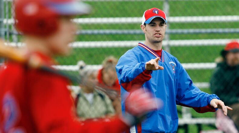 Northwestern head baseball coach Brent Parke offers advice to his players between innings during a game in 2007 at Northeastern High School. Staff Photo by Barbara J. Perenic
