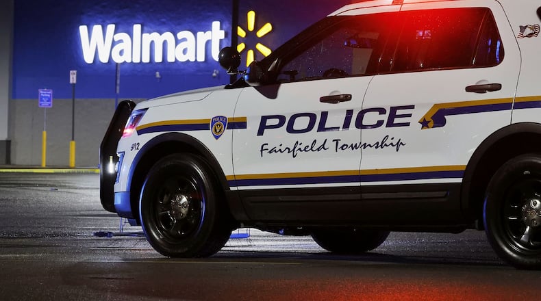 Police investigate a fatal shooting at Walmart on Princeton Road in Fairfield Township Thursday, May 26, 2022. NICK GRAHAM/STAFF