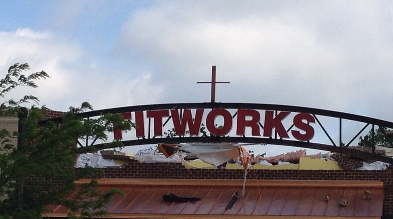 The cross exposed where a facade was ripped off. Staff photo by Mike Campbell