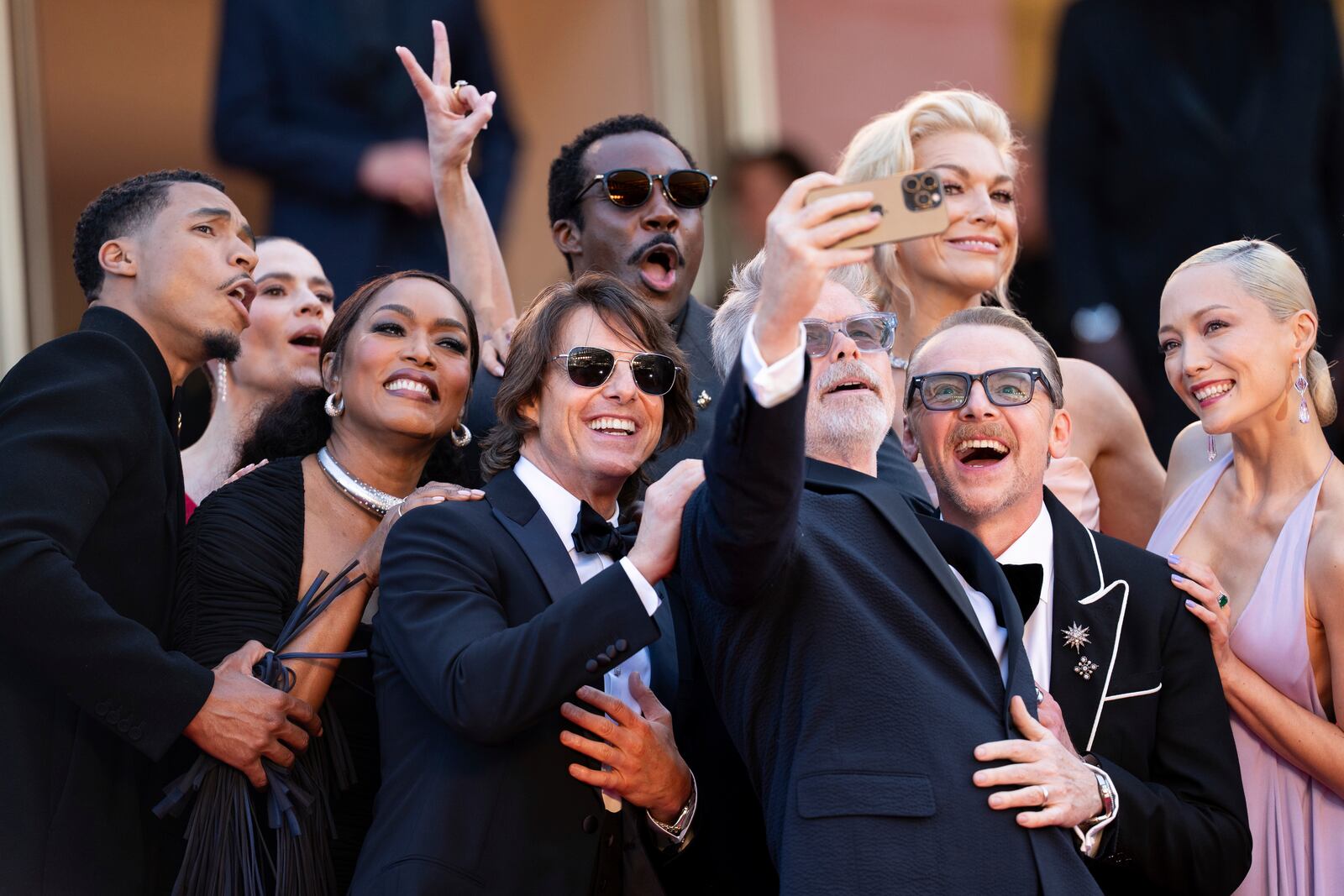 Greg Tarzan Davis, from left, Hayley Atwell, Angela Bassett, Tom Cruise, Tramell Tillman, director Christopher McQuarrie, Hannah Waddingham, Simon Pegg and Pom Klementieff pose for photographers upon arrival at the premiere of the film 'Mission: Impossible - The Final Reckoning' at the 78th international film festival, Cannes, southern France, Wednesday, May 14, 2025. (Photo by Scott A Garfitt/Invision/AP)