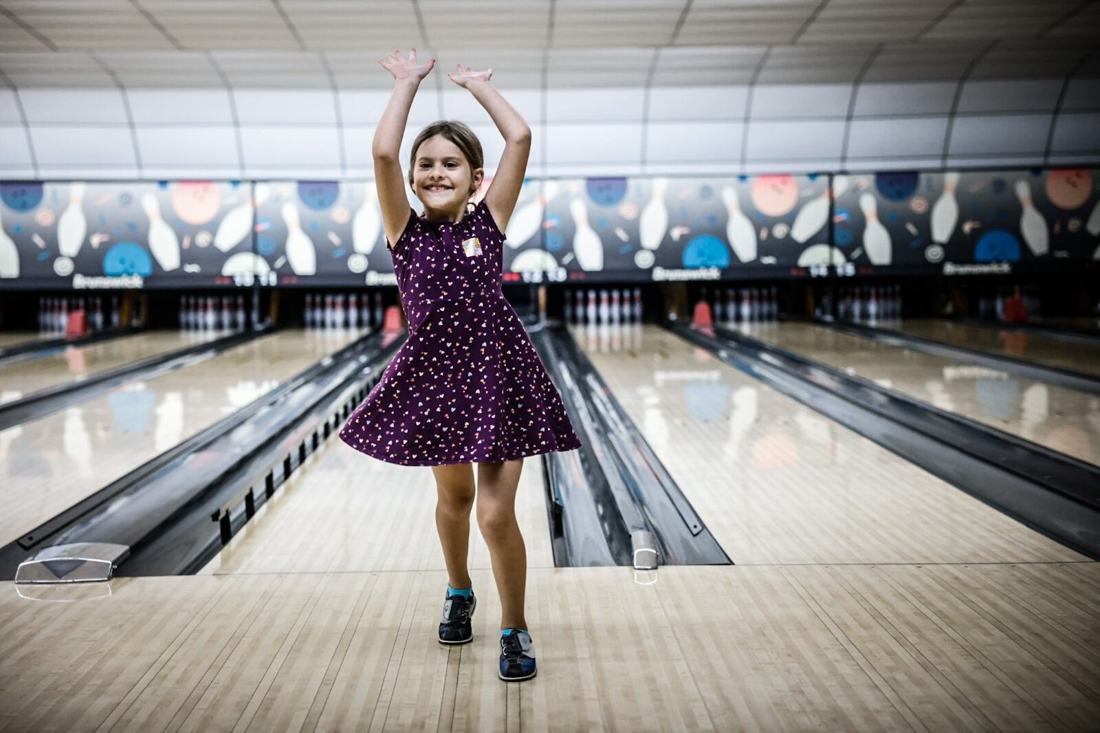 Makayla Campbell, from Troy, celebrates a nice throw with her grandmother, Carol Gibbson and her brother, Logan Campbell, not pictured, at Thunderbowl Lanes in Englewood Thursday June 29, 2023. JIM NOELKER/STAFF