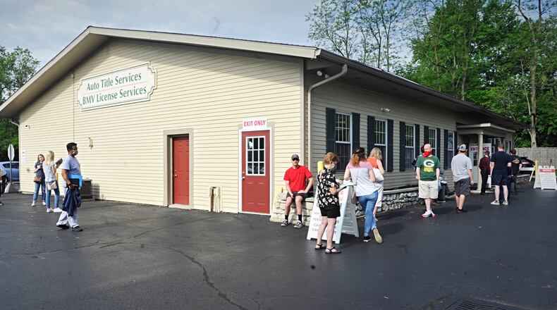 Long lines formed in Centerville before the Bureau of Motor Vehicles reopened on Tuesday. MARSHALL GORBY/STAFF