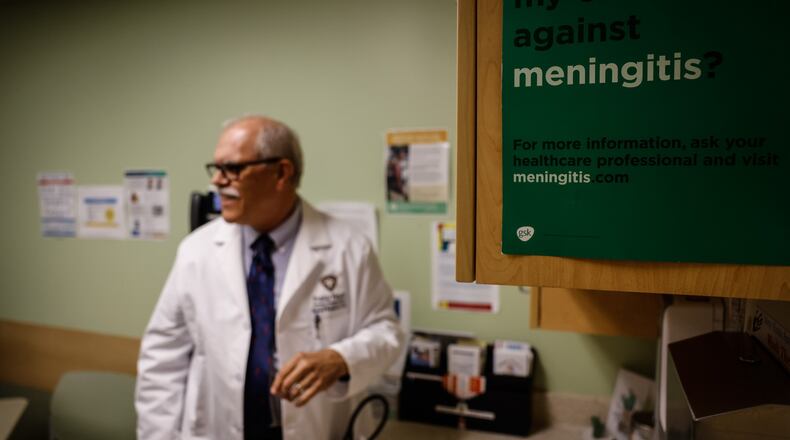 Public Health - Dayton & Montgomery County medical director Dr. Michael Dohn talks to the media about the importance of getting children immunized before school starts this year. JIM NOELKER/STAFF
