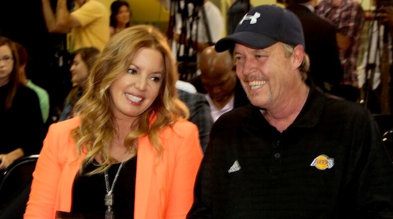 Jeanie and Jim Buss talk before the start of a news conference at the Toyota Sports Center in El Segundo, Calif., on August 10, 2012. (Anne Cusack/Los Angeles Times/TNS)