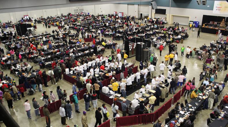 Thousands were fed a hot Thanksgiving Day meal during A Feast of Giving at the Dayton Convention Center Thursday, Nov. 26, 2015.