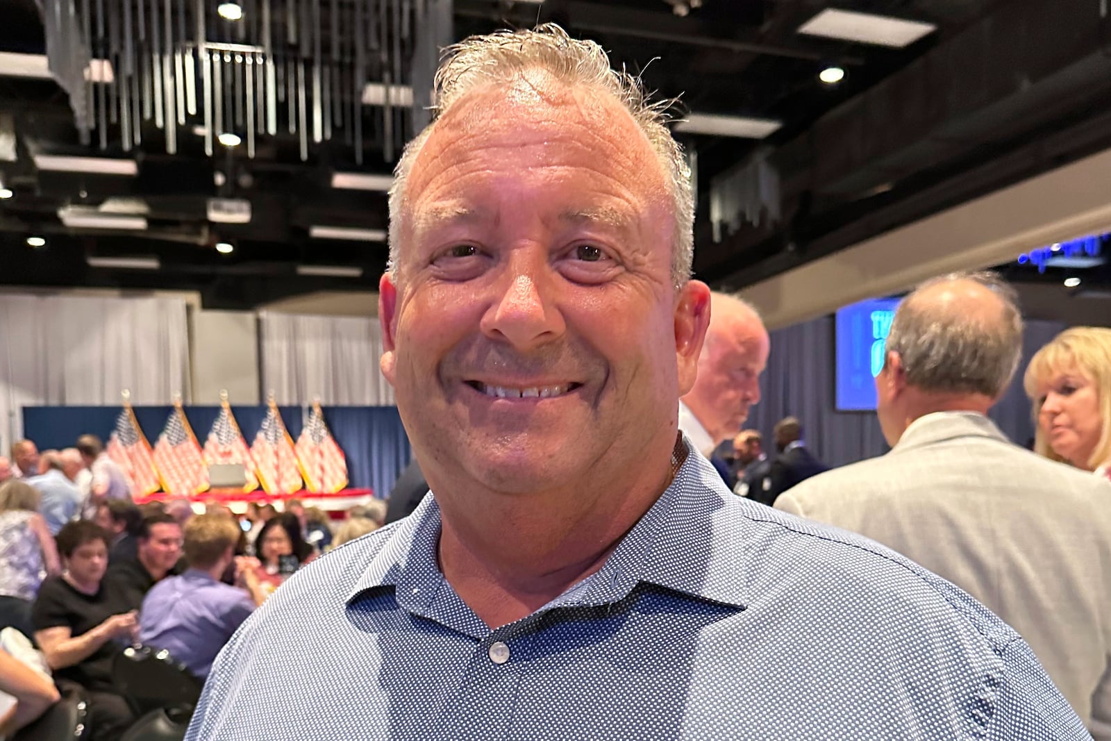 Clark Spieles, a trustee in Shawnee Township, Ohio, poses for a photo during a Republican fundraiser on Tuesday, June 24, 2025, in Lima, Ohio, featuring Vice President JD Vance. (AP Photo/Julie Carr Smyth)
