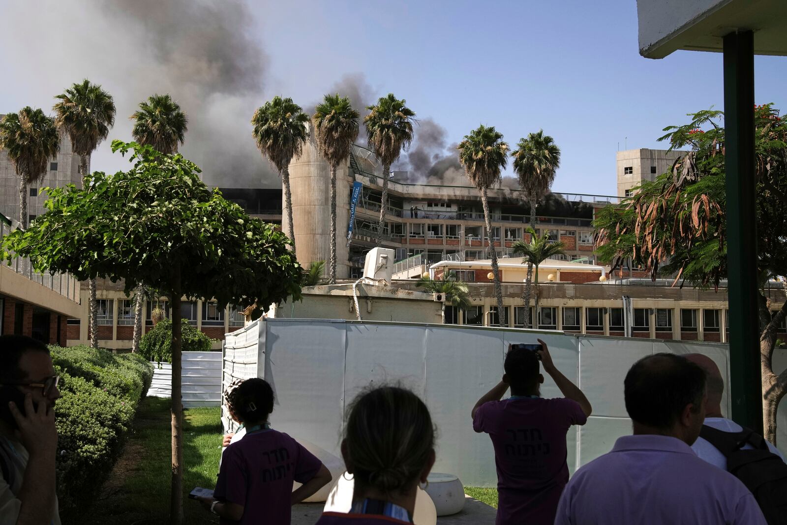 Smokes raises from a building of the Soroka hospital complex after it was hit by a missile fired from Iran in Be'er Sheva, Israel, Thursday, June 19, 2025. (AP Photo/Leo Correa)