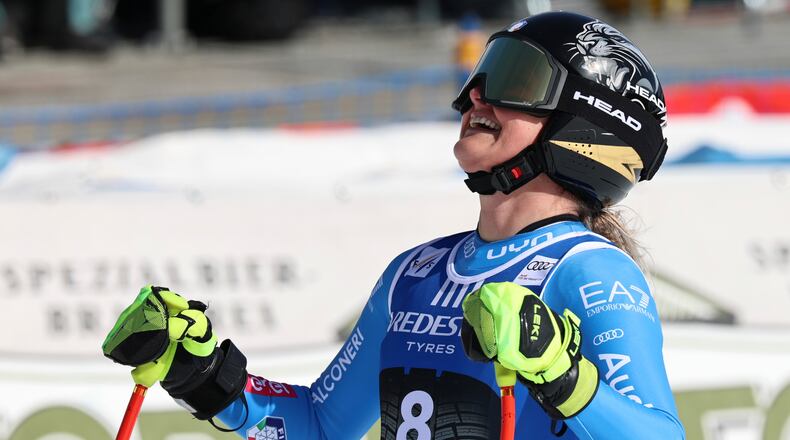 Italy's Laura Pirovano celebrates at the finish area of an alpine ski, women's World Cup downhill, in Val di Fassa, Italy, Friday, February. 27, 2026. (AP Photo/Marco Trovati)