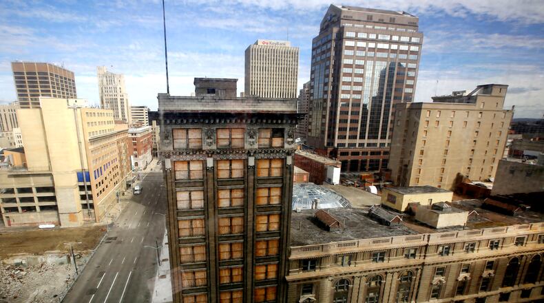 Exterior view of the Arcade from the 40 W. Fourth Building. The arcade can be redeveloped, a Dayton consultant is saying. “We believe that a major redevelopment of the arcade block is feasible and warranted, ” a report by Sandvick Architects says in a section titled “summary and recommendations.” “There is a need for market rate and affordable downtown residential units that can offer safe, secured parking with amenities that highlight the urban living experience, ” the report adds. “The arcade block is a spectacular architectural gem of not only statewide but national significance. Its exceptional quality of space and design excellence have the capacity to dramatically increase the success of the proposed uses.” In December 2014, the city of Dayton commissioned Sandvick and THP Limited Inc. in Cincinnati to analyze the possibility of arcade redevelopment into a downtown living space. The historical arcade — for decades a much-loved centerpiece of downtown Dayton — consists of nine interconnected and surrounding buildings. The analysis was to offer a task force selected by Mayor Nan Whaley with data and cost estimates of proposed uses and demolition scenarios.. TY GREENLEES / STAFF
