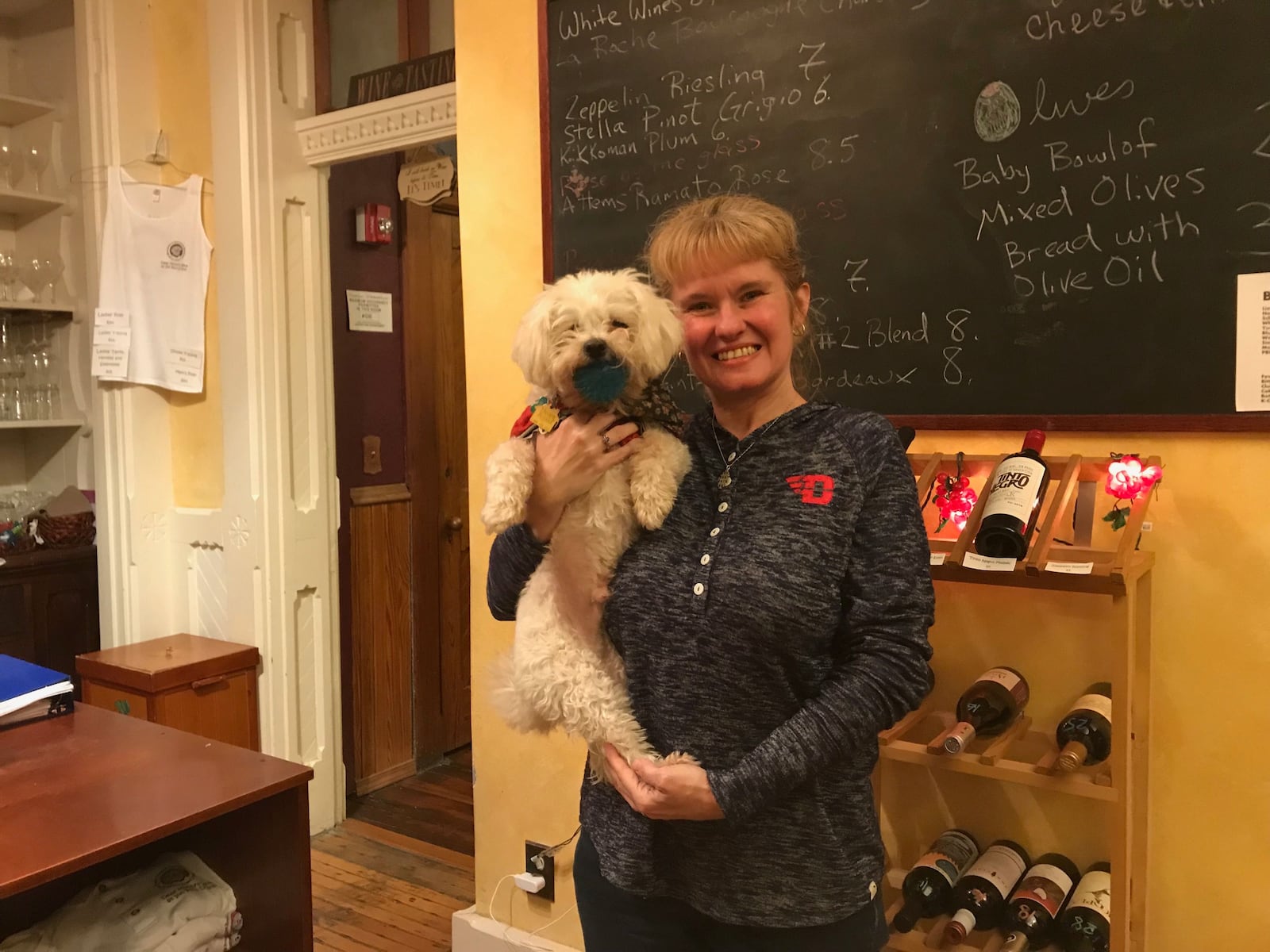Owner of Deaf Monty's Wine, Leslie Gonya, and her dog "Lance" in 2018.