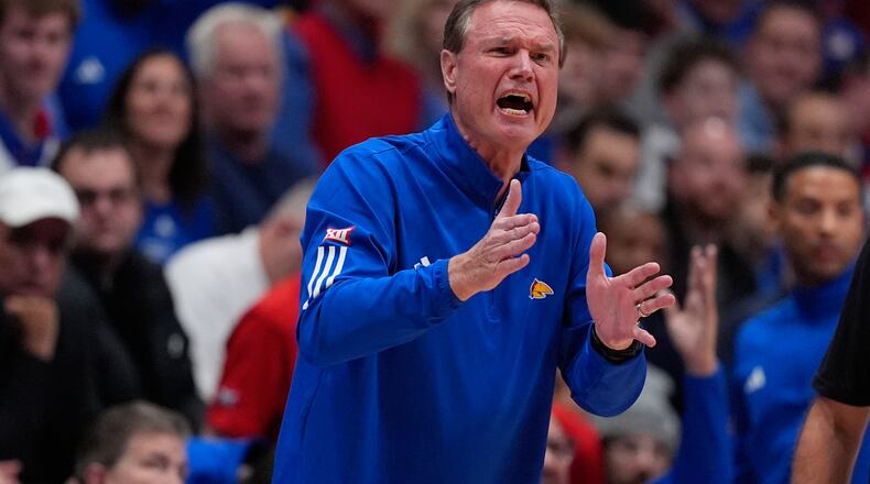 Kansas head coach Bill Self motions to his team during the first half of an NCAA college basketball game against Baylor, Friday, Jan. 16, 2026, in Lawrence, Kan. (AP Photo/Charlie Riedel)