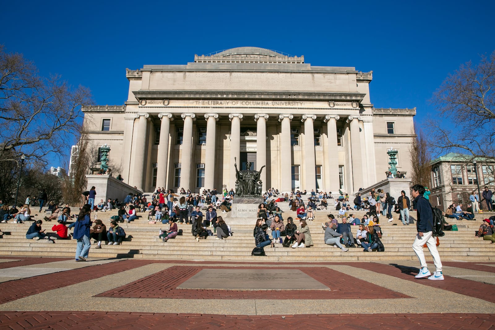 FILE - Students sit on the front steps of Low Memorial Library on the Columbia University campus in New York City, Feb. 10, 2023. (AP Photo/Ted Shaffrey, File)