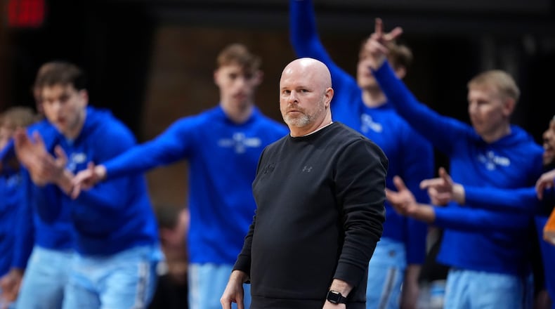 Indiana State coach Josh Schertz watches from the bench during the first half of an NCAA college basketball game against Utah in the semifinals of the NIT, Tuesday, April 2, 2024, in Indianapolis. (AP Photo/Michael Conroy)