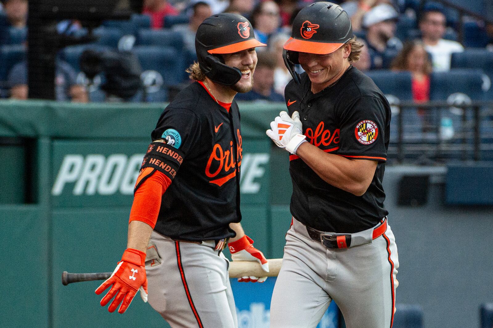 Baltimore Orioles' Gunnar Henderson, left, congratulates Jackson Holliday after his solo home run off Cleveland Guardians starting pitcher Slade Cecconi during the sixth inning of a baseball game, Wednesday, July 23, 2025, in Cleveland. (AP Photo/Phil Long)
