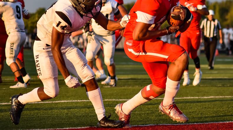 Fairfield's Erick All carries the ball in for a touchdown while being trailed by Lakota East's Brandon Britton during their Sept. 15 game at Fairfield Stadium. The host Indians won 48-14. NICK GRAHAM/STAFF