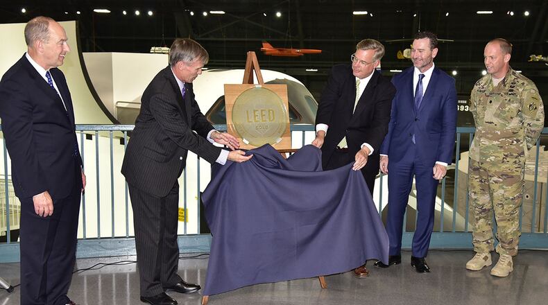 Celebrating the National Museum of the U.S. Air Force’s Leadership in Energy and Environmental Design Gold certification during an unveiling ceremony Aug. 3, were (left to right): Philip Soucy, chairman, Board of Trustees, Air Force Museum Foundation Inc.; Jack Hudson, museum director; Kyle Rooney, senior vice president, Turner Construction Co.; Brian Curtin, president/CEO and chairman of the board, BRPH Architects-Engineers Inc.; and Lt. Col. Robert Newbauer, deputy commander, U.S. Army Corps of Engineers, Louisville District. (U.S. Air Force photo/Ken LaRock)