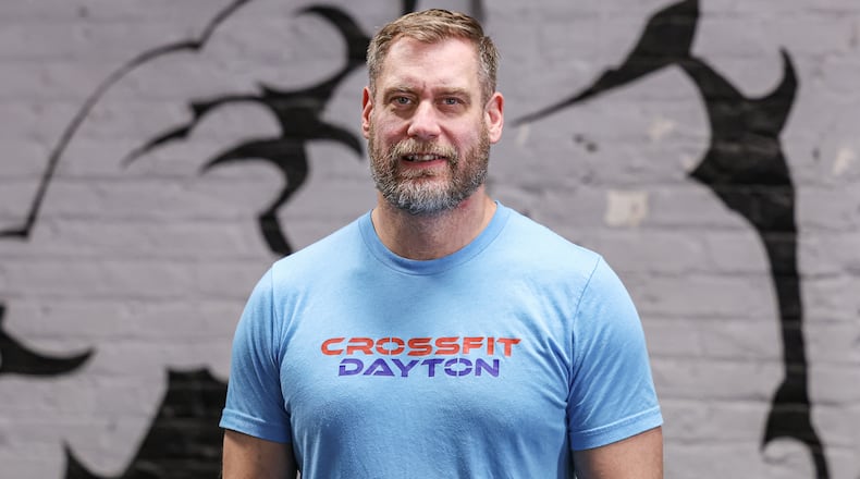 Corey Harman has been named a Dayton Daily News Community Gem for his work as the gym manager and head coach at CrossFit Dayton. BRYANT BILLING / STAFF