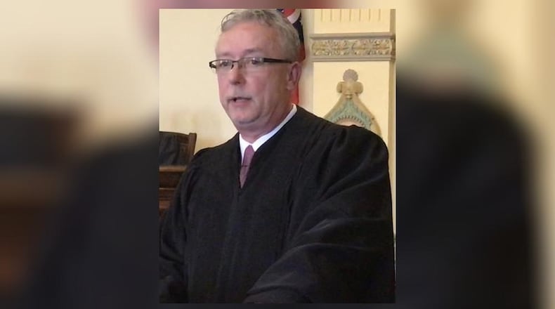 Scott Altenburger of Troy was given his oath as the county s new Juvenile/Probate Court judge. STEVE BAKER/STAFF