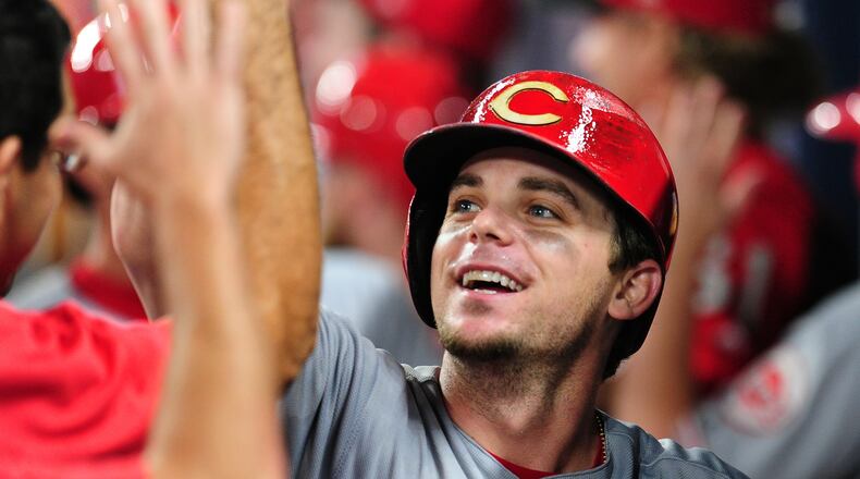 ATLANTA, GA - AUGUST 19: Scooter Gennett #4 of the Cincinnati Reds celebrates with teammates after hitting a ninth inning grand slam against the Atlanta Braves at SunTrust Park on August 19, 2017 in Atlanta, Georgia. (Photo by Scott Cunningham/Getty Images)