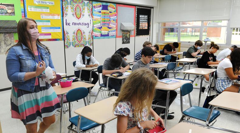 Students have an almost back to normal first day of classes at Kettering Middle School, Thursday, Aug. 12, 2021. MARSHALL GORBY\STAFF