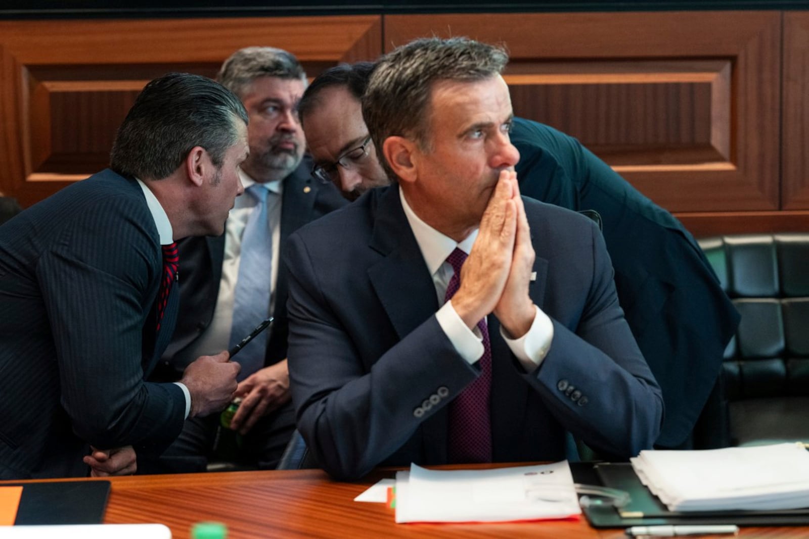 This image provided by the White House shows CIA Director John Ratcliffe, in foreground seated, as Defense Secretary Pete Hegseth, left, speaks with national security adviser Andy Baker with White House counsel David Warrington seated in background in the Situation Room, Saturday, June 21, 2025, at the White House in Washington. (The White House via AP)